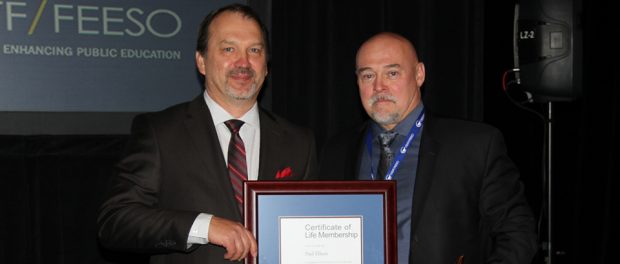 Photo of Harvey Bischof, President-elect presenting outgoing President Paul Elliott with OSSTF/FEESO Life Member Award