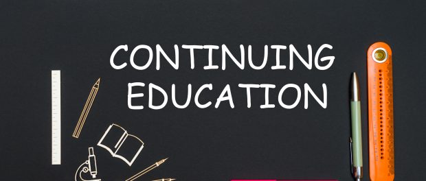 An illustration of a black board with the words continuing education written on it