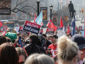 Photo of people protesting education cuts at Queen's Park