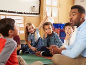 Photo of ECE worker teaching young children