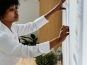 woman writing on a board on the wall