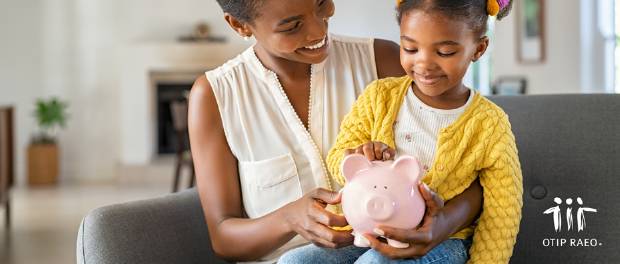 OTIP Black mother and daughter putting money in a piggy bank