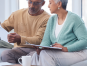 older couple looking at a document