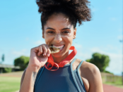 Woman biting a medal