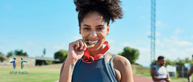 OTIP Redy Set Go Woman biting a medal